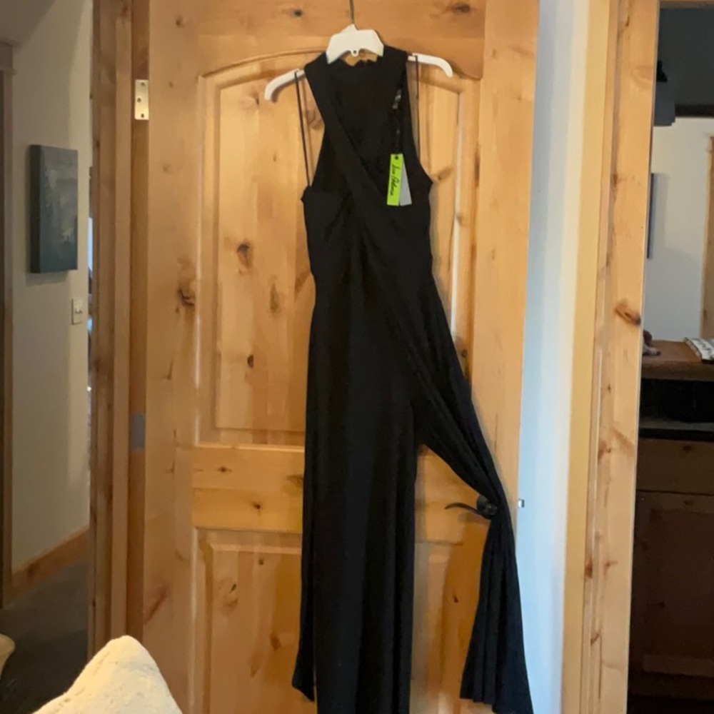 NWT woman’s jumpsuit wide legs criss cross front size large back zipper.